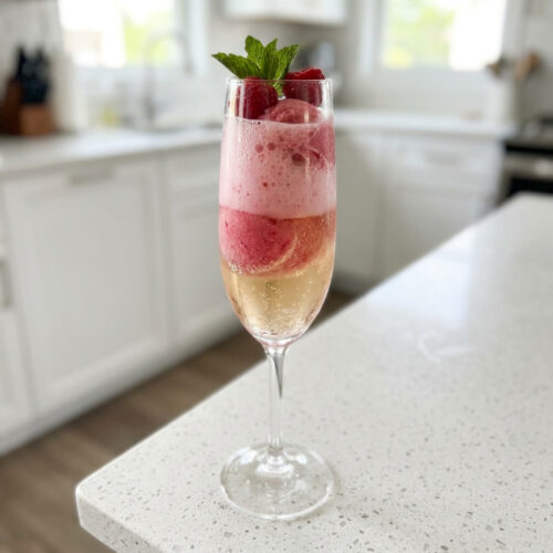 Raspberry Champagne Float Cocktail Recipe - Thirsty Tales